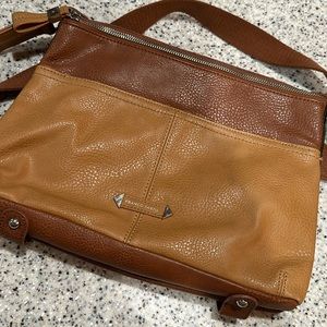 A beautiful leather cross body purse with many pockets